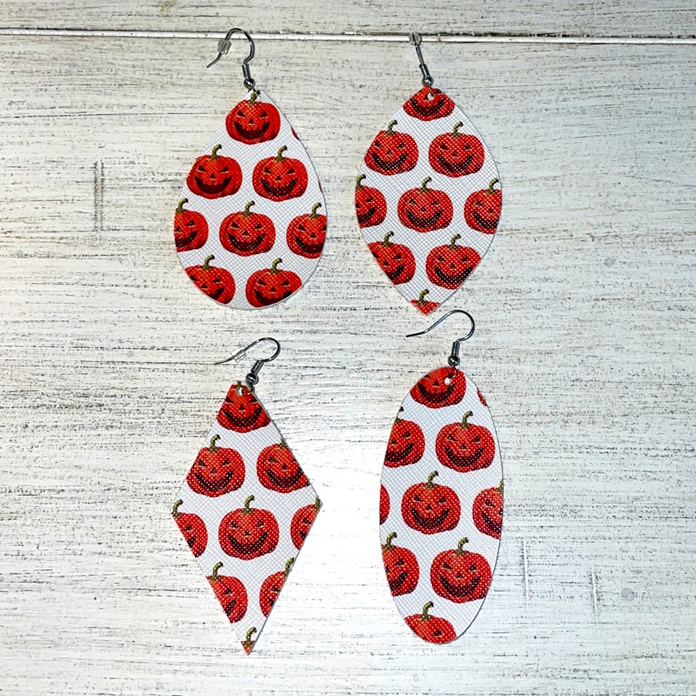 White with orange jack o lantern faux leather earrings